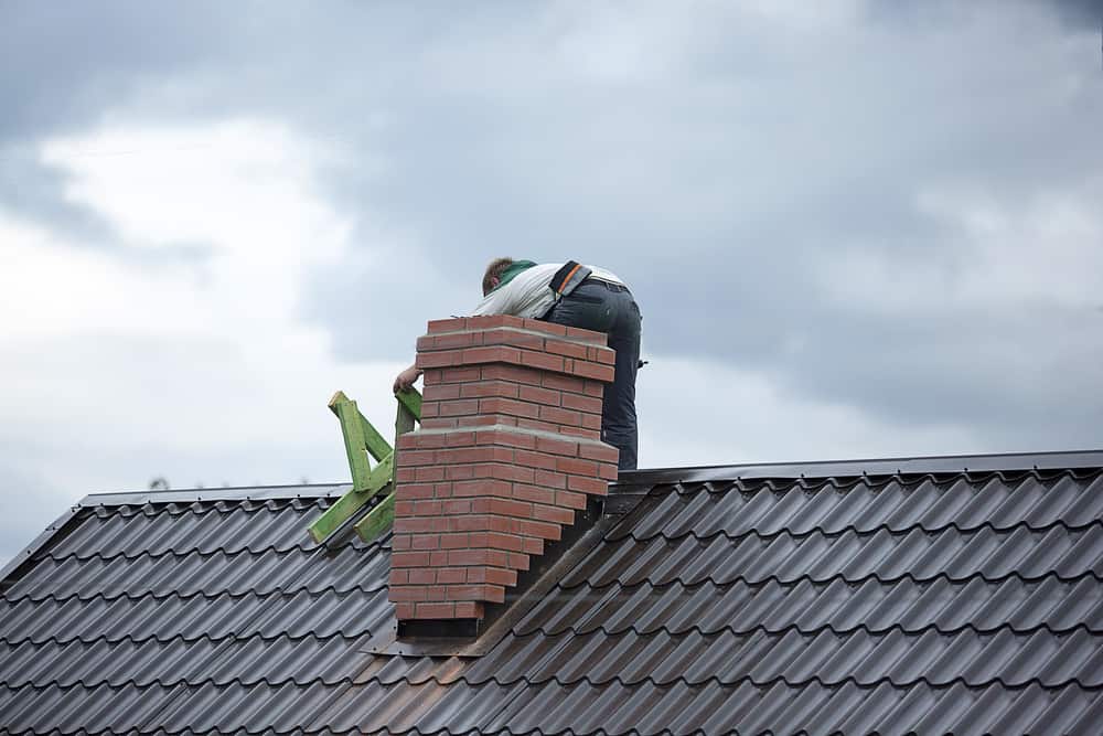 man working on chimney